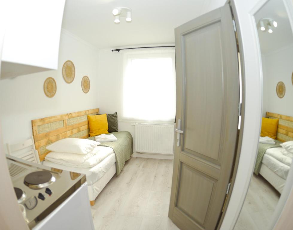 Postel nebo postele na pokoji v ubytování Raba92 Apartman House