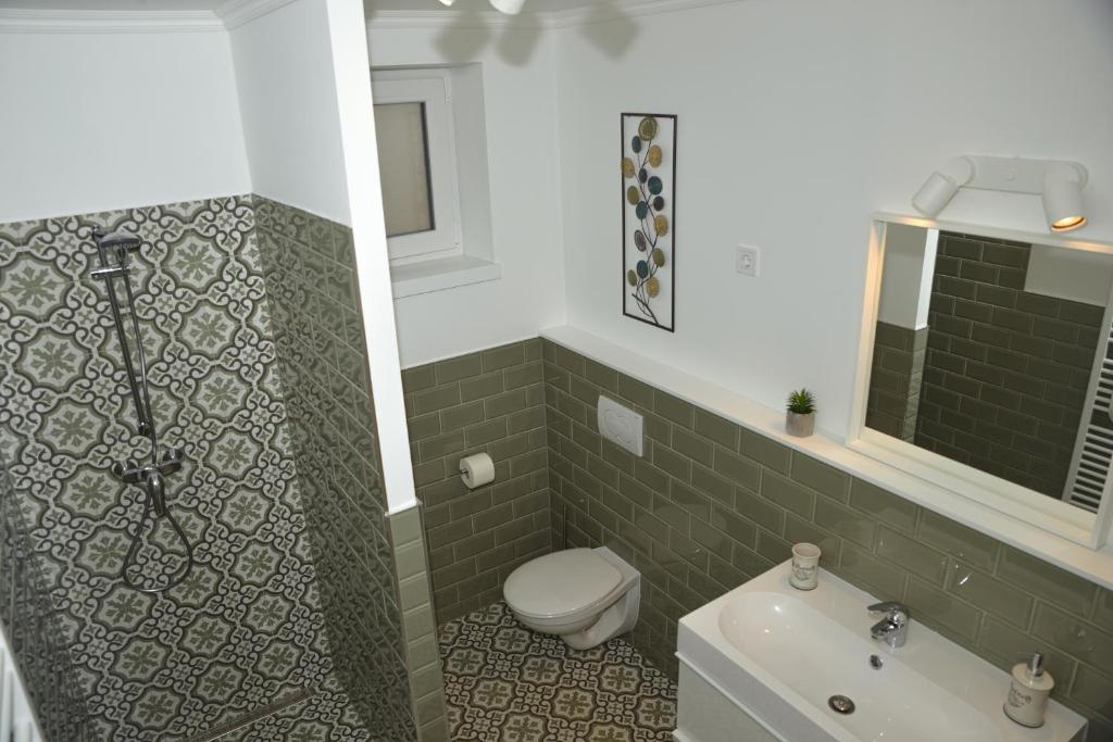Koupelna v ubytování Raba92 Apartman House