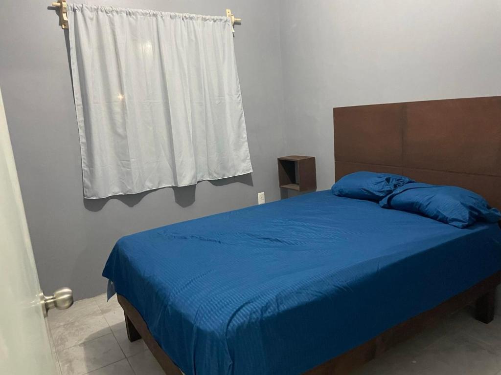 Säng eller sängar i ett rum på Departamento Altamira Puerto Industrial
