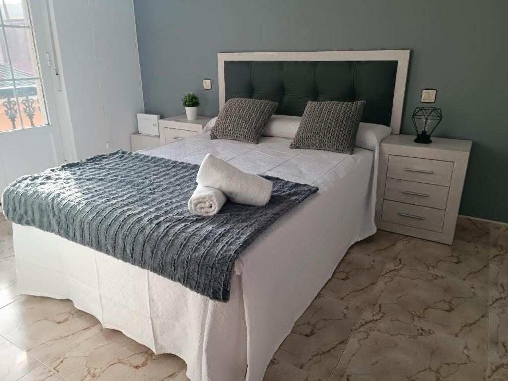 Postel nebo postele na pokoji v ubytování Casa El Rincón de Alberto con Piscina CLIMATIZADA y Calefacción