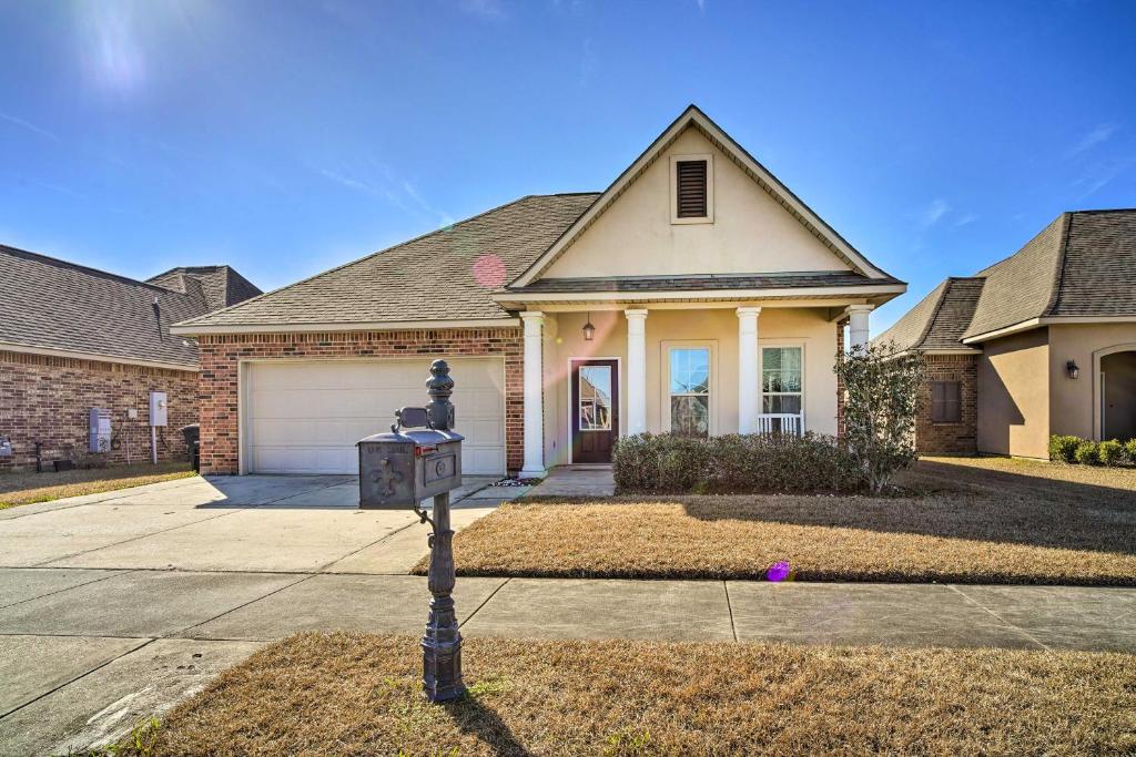 a house with a parking meter in front of it at Baton Rouge Vacation Rental about 4 Mi to LSU in Baton Rouge