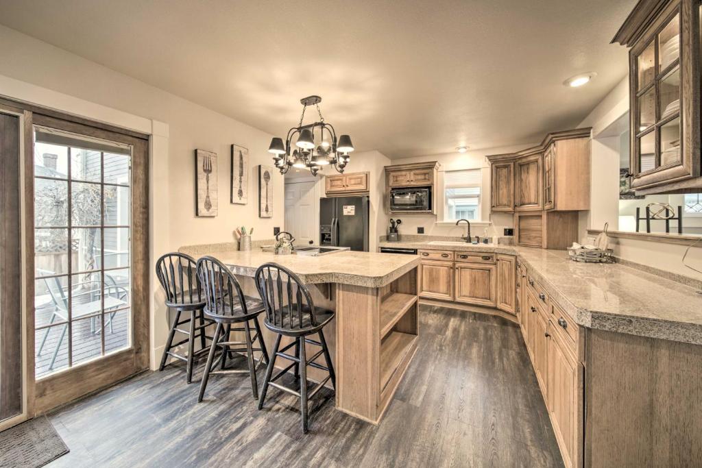 a kitchen with a large island with bar stools at Charming Kellogg Home Near Outdoor Activities in Kellogg