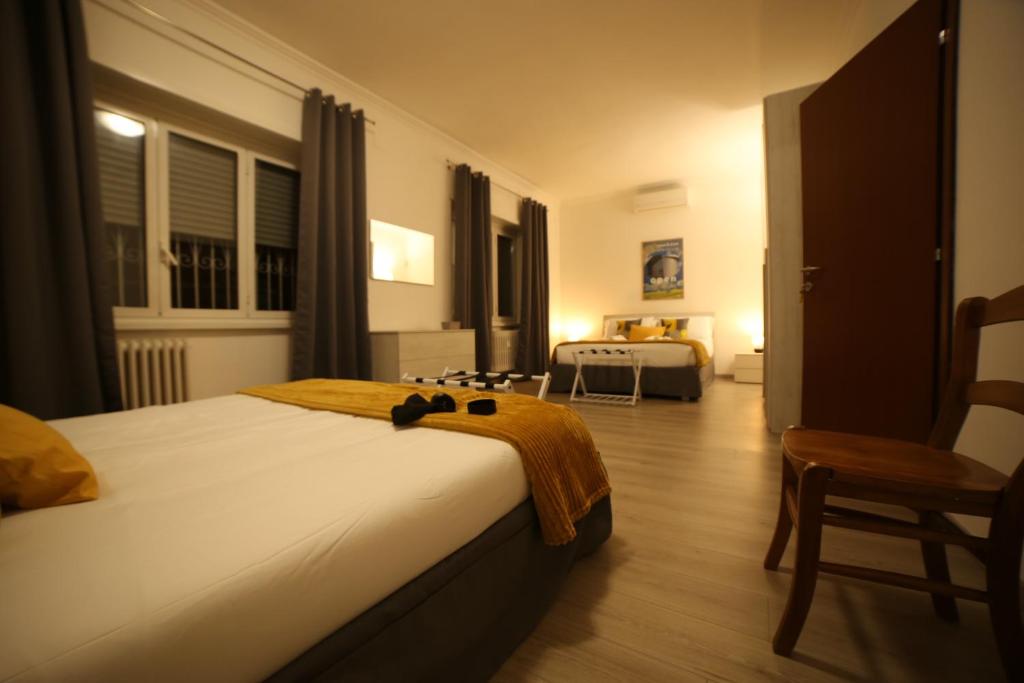 A bed or beds in a room at Appia Antica Guest House