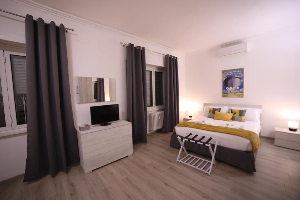 A bed or beds in a room at Appia Antica Guest House