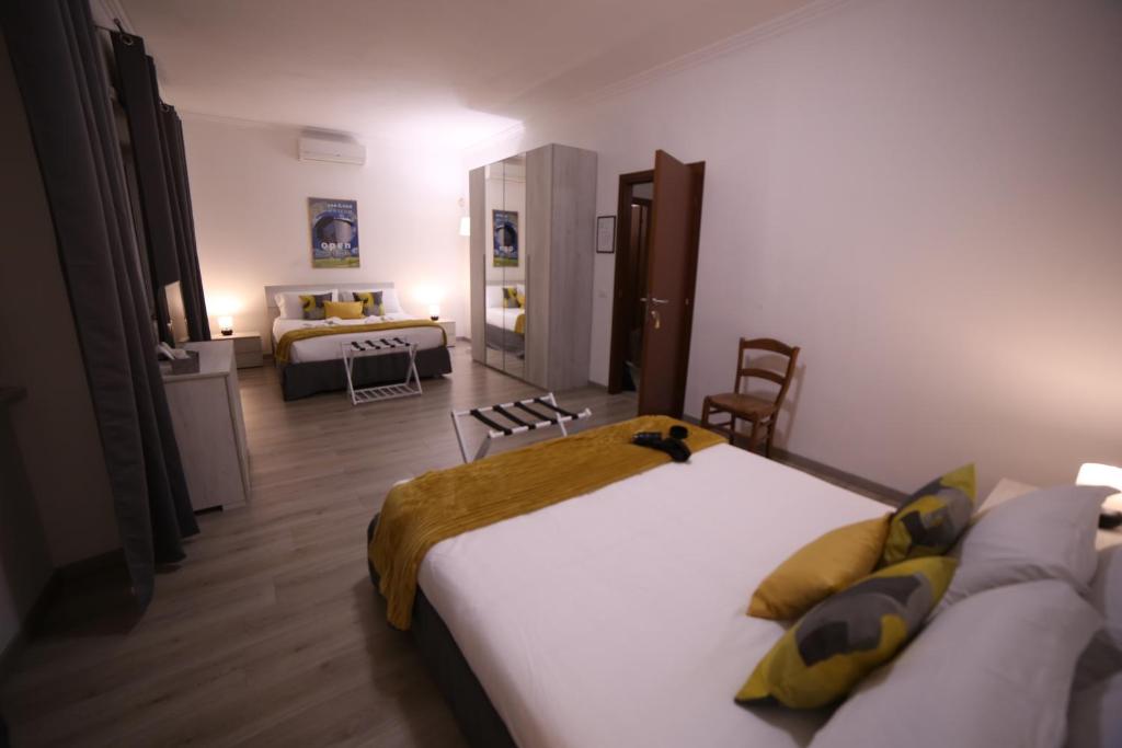 A bed or beds in a room at Appia Antica Guest House