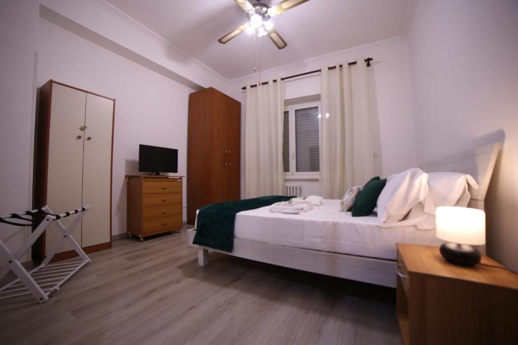 A bed or beds in a room at Appia Antica Guest House