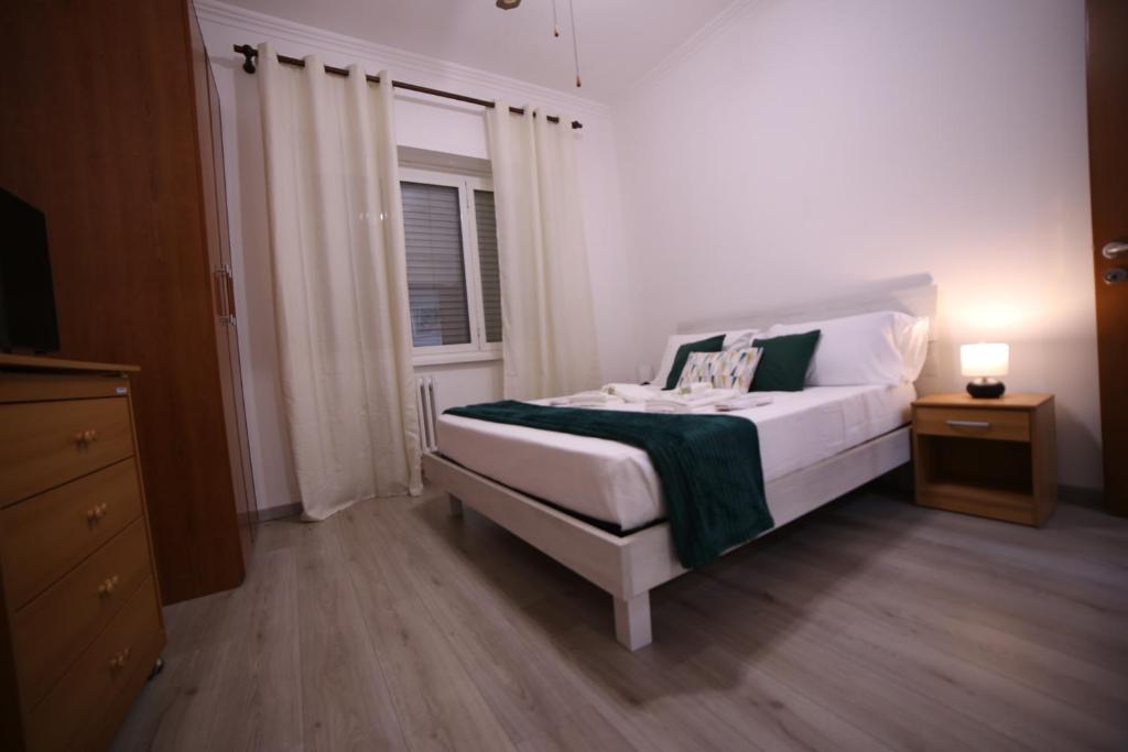 A bed or beds in a room at Appia Antica Guest House