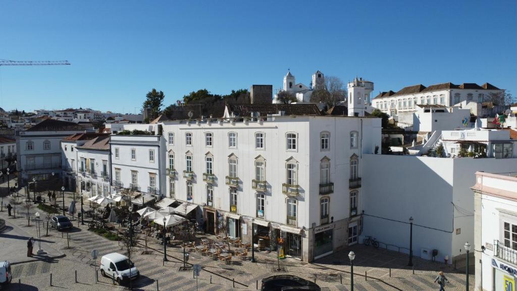 an aerial view of a white building in a city at Formosa Guest House in Tavira