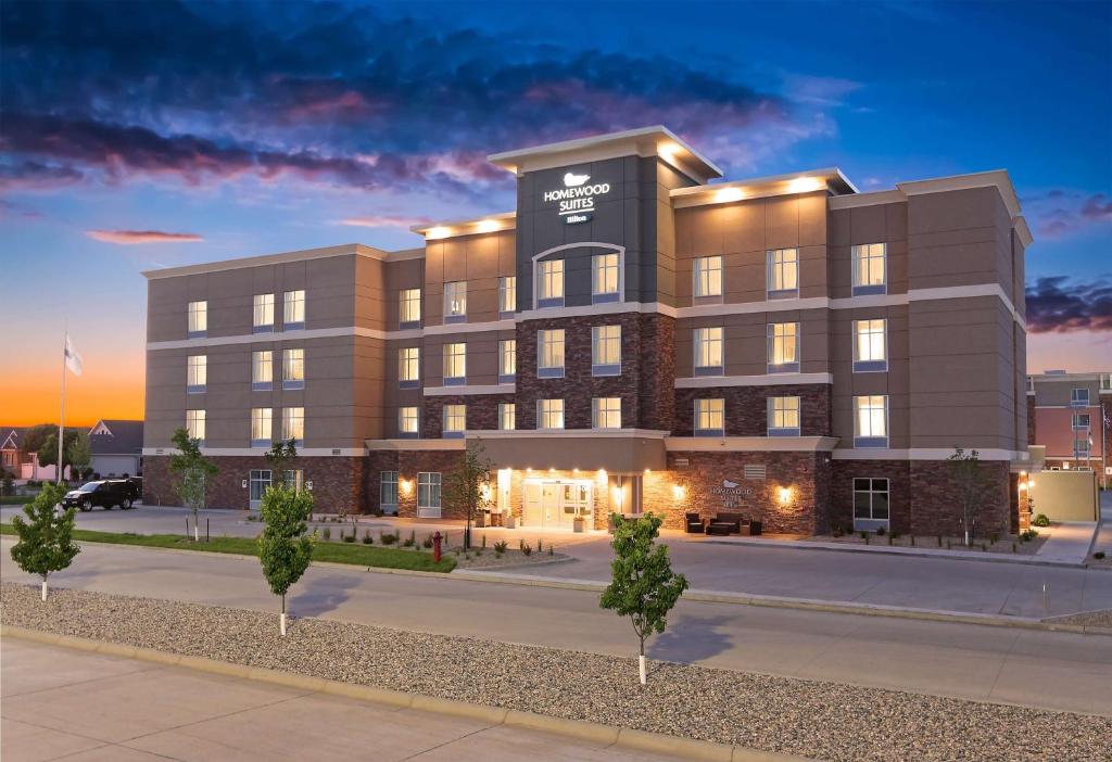 a rendering of the office building at dusk at Homewood Suites By Hilton West Fargo/Sanford Medical Center in Fargo