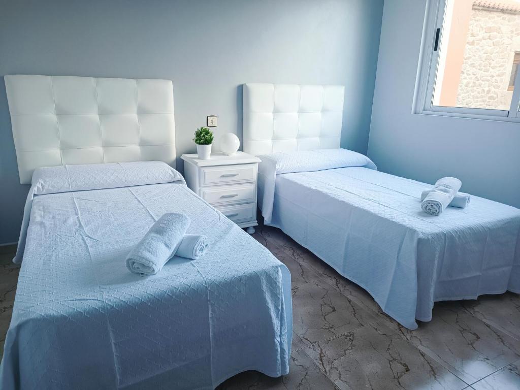 Postel nebo postele na pokoji v ubytování Casa El Rincón de Alberto con Piscina CLIMATIZADA y Calefacción