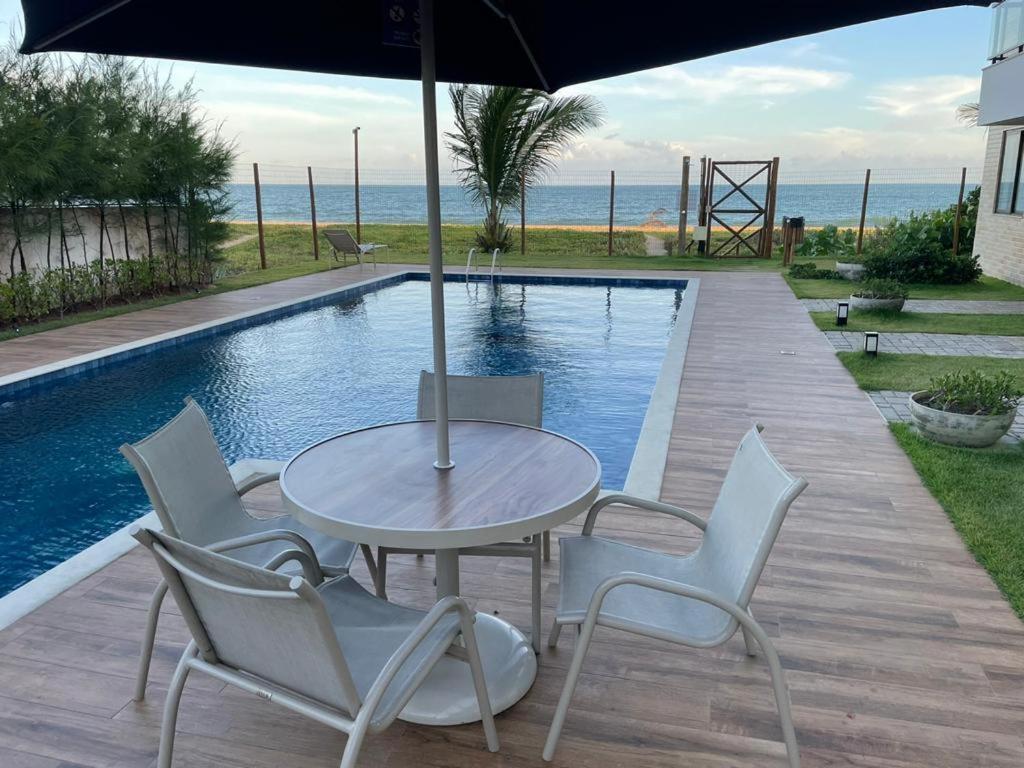 Bazén v ubytování Ondas de Itacimirim, o paraíso é aqui! Pé na areia nebo v jeho okolí