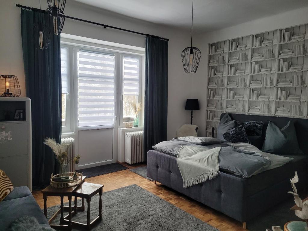 a living room with a bed and a couch at Apartment Mohr am Semmering in Semmering