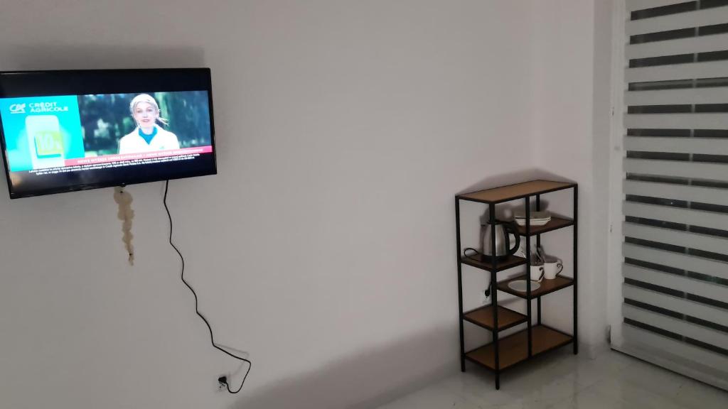 a flat screen tv hanging on a wall at RMF Naworol 7 in Szczecin
