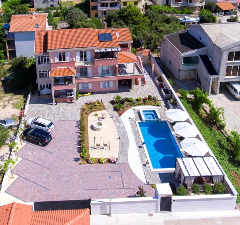 an aerial view of a house with a swimming pool at House Grebastica (886) in Grebaštica