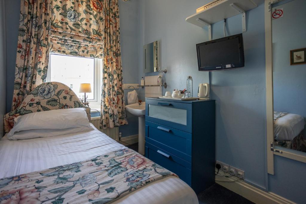Postel nebo postele na pokoji v ubytování Homelands Guest House