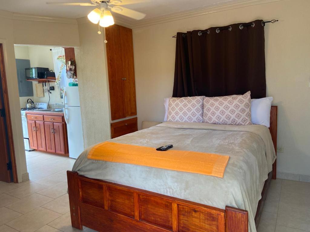 a bedroom with a large bed in a room at Fishtail Palms - Sapodilly in Stuart Manor