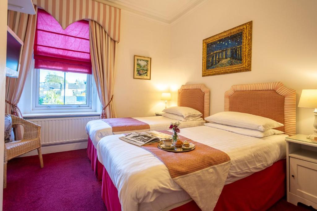Postel nebo postele na pokoji v ubytování Homelands Guest House