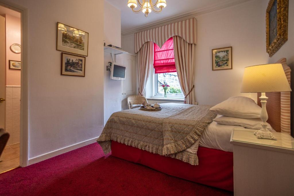 Postel nebo postele na pokoji v ubytování Homelands Guest House