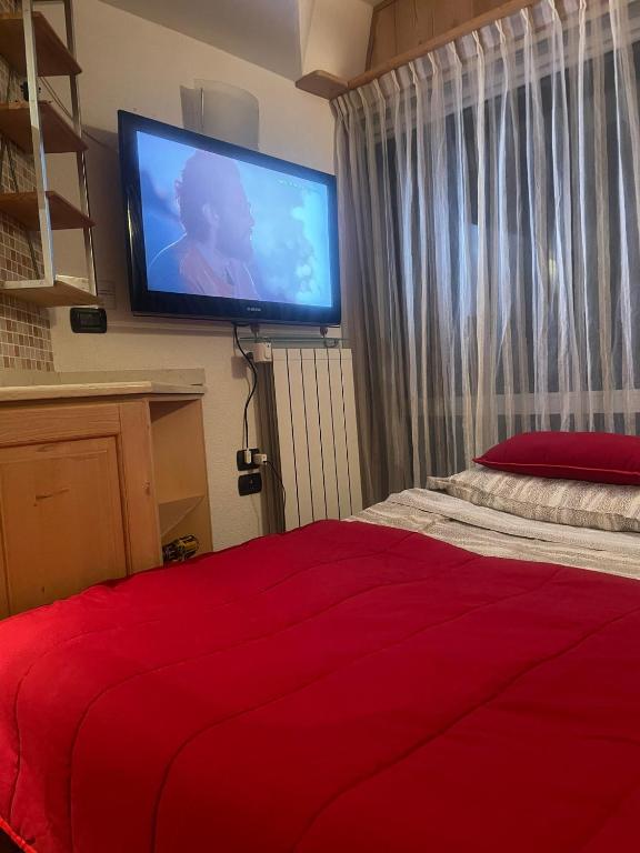 Postel nebo postele na pokoji v ubytování BAITA SOLE ALTO la tua casa sulle piste da sci