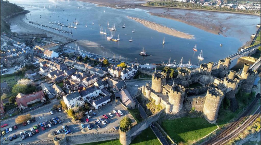 an aerial view of a castle with a harbor at Poppy’s Place in Llandudno Junction