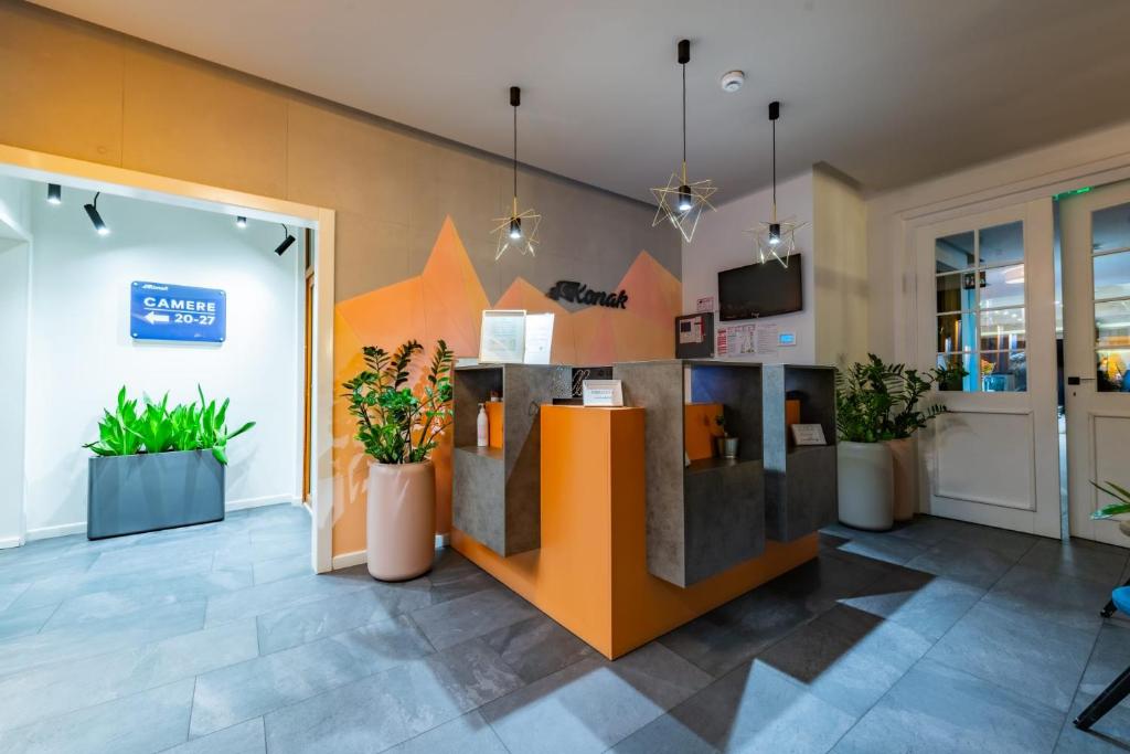 a lobby of a store with potted plants at Konak Sibiu in Sibiu