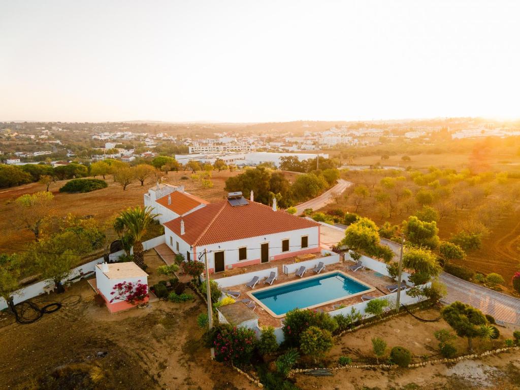 an aerial view of a house with a swimming pool at Quinta Coelho in Guia