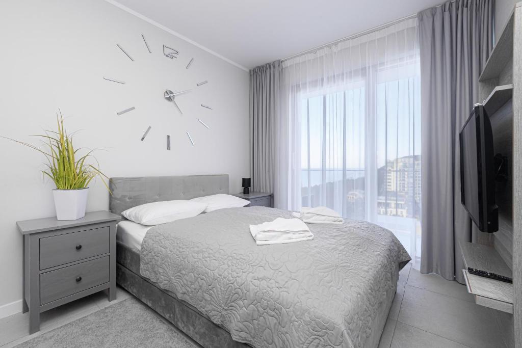 Postel nebo postele na pokoji v ubytování Balticus Apartamenty Standard Promenada Gwiazd 14