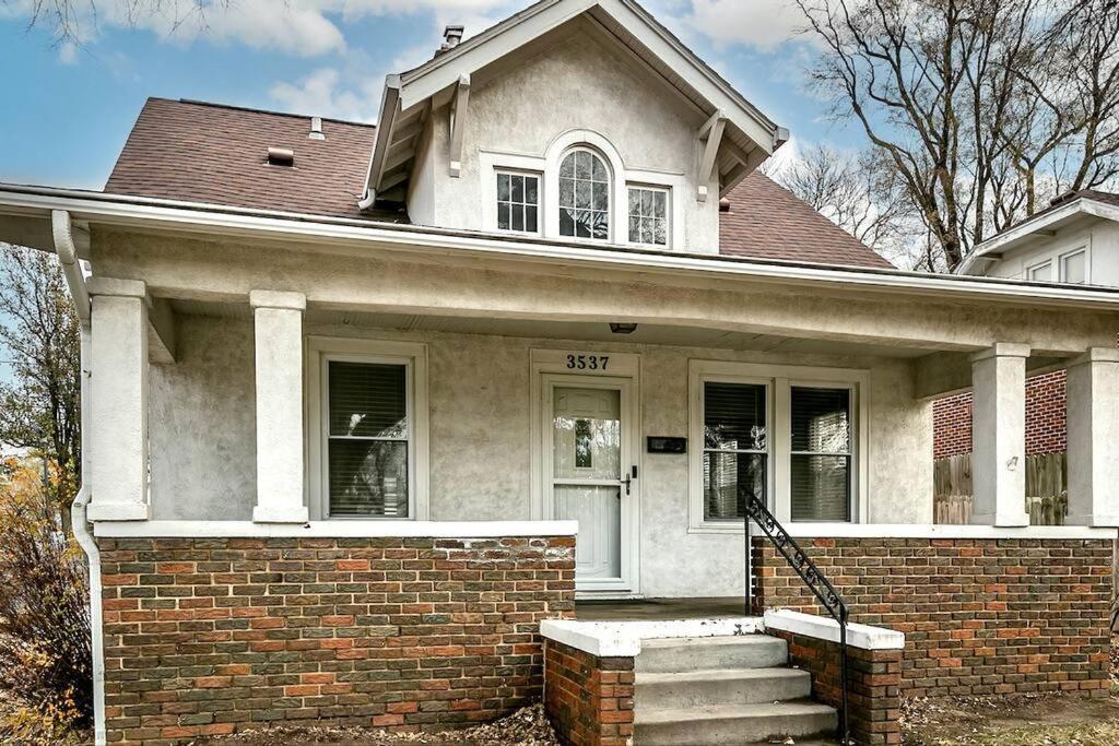 a home with a brick house with a brick staircase at Bungalow Adventures in Omaha
