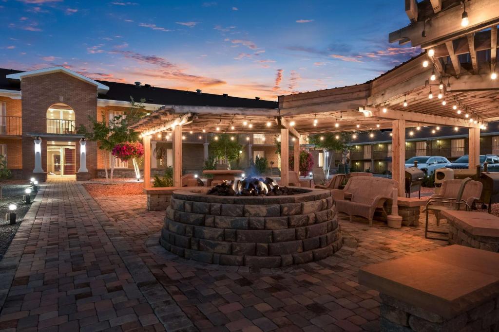 an outdoor patio with a fire pit and lights at Best Western Plus Cedar City in Cedar City