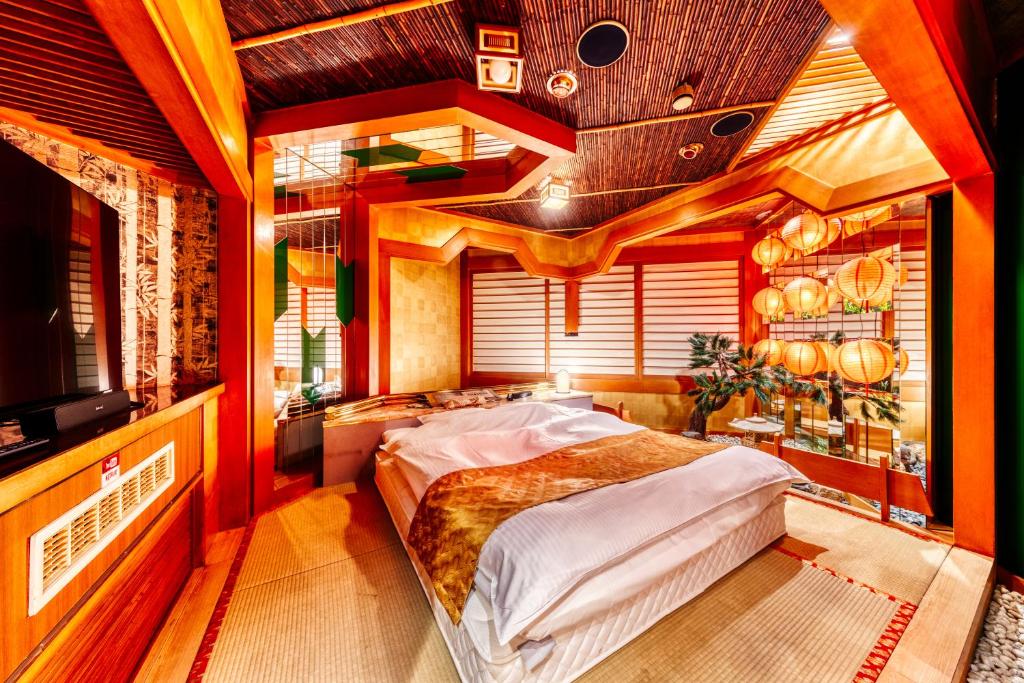Postel nebo postele na pokoji v ubytování Hotel Chronos -Adult Only