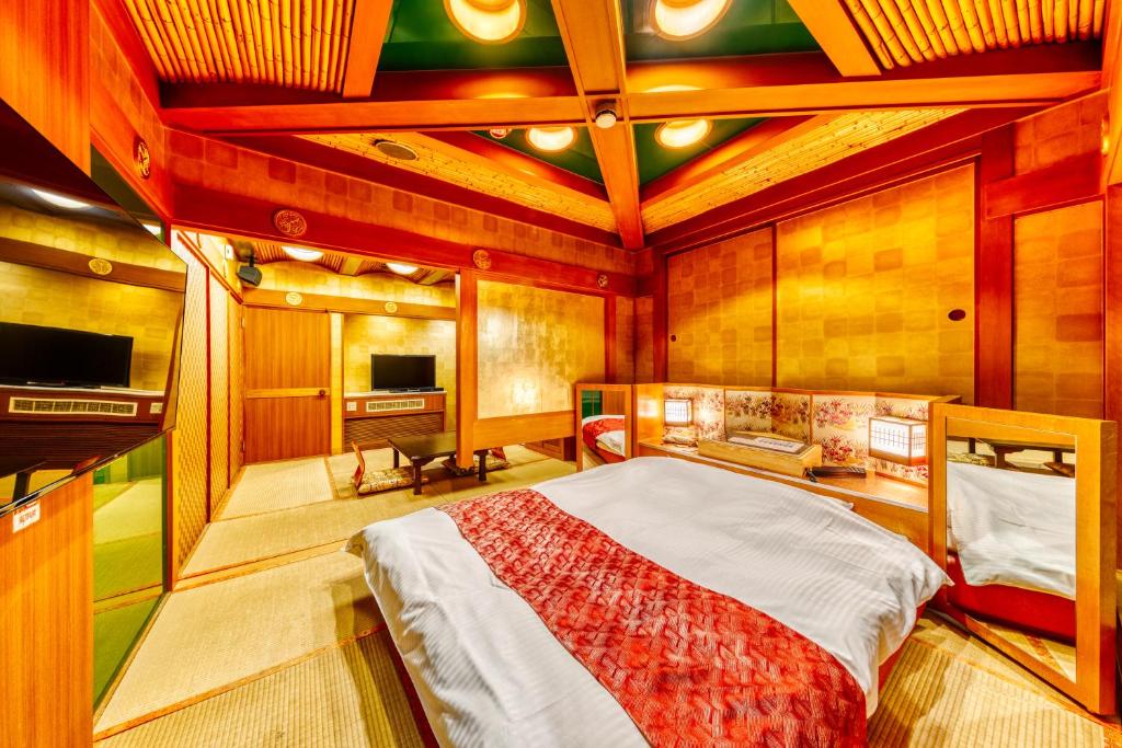 TV a/nebo společenská místnost v ubytování Hotel Chronos -Adult Only
