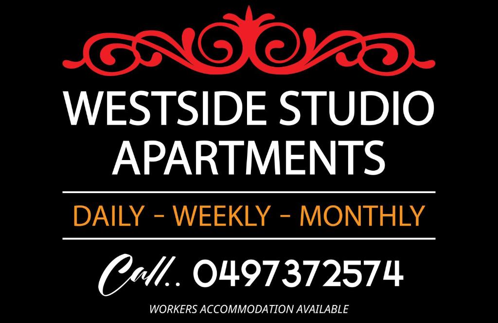 a sign that says westcliffe studio apartments with a red swirl at Westside Studio Apartments in Armidale
