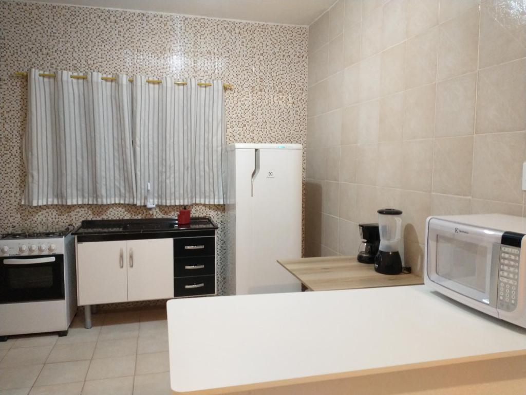 Kuchyň nebo kuchyňský kout v ubytování Recanto da Lagoa Flat