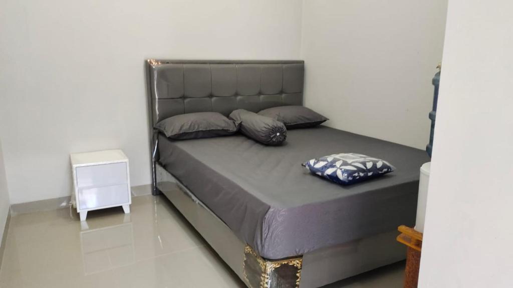 Postel nebo postele na pokoji v ubytování JM HOMESTAY
