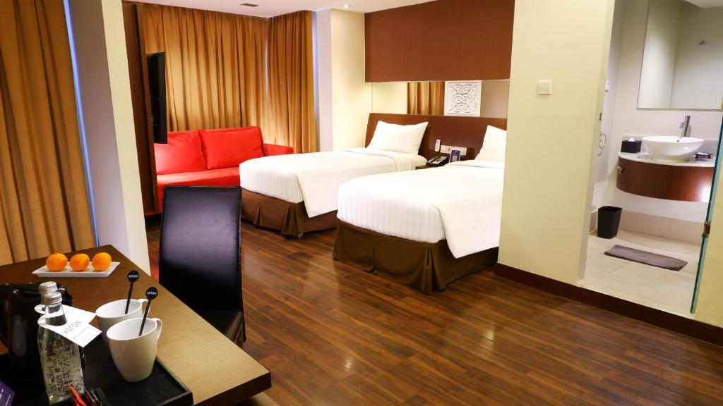 Postel nebo postele na pokoji v ubytování ASTON Pluit Hotel & Residence
