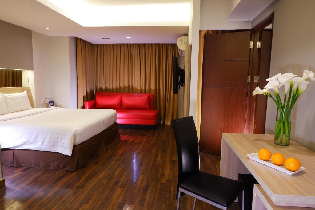 Postel nebo postele na pokoji v ubytování ASTON Pluit Hotel & Residence