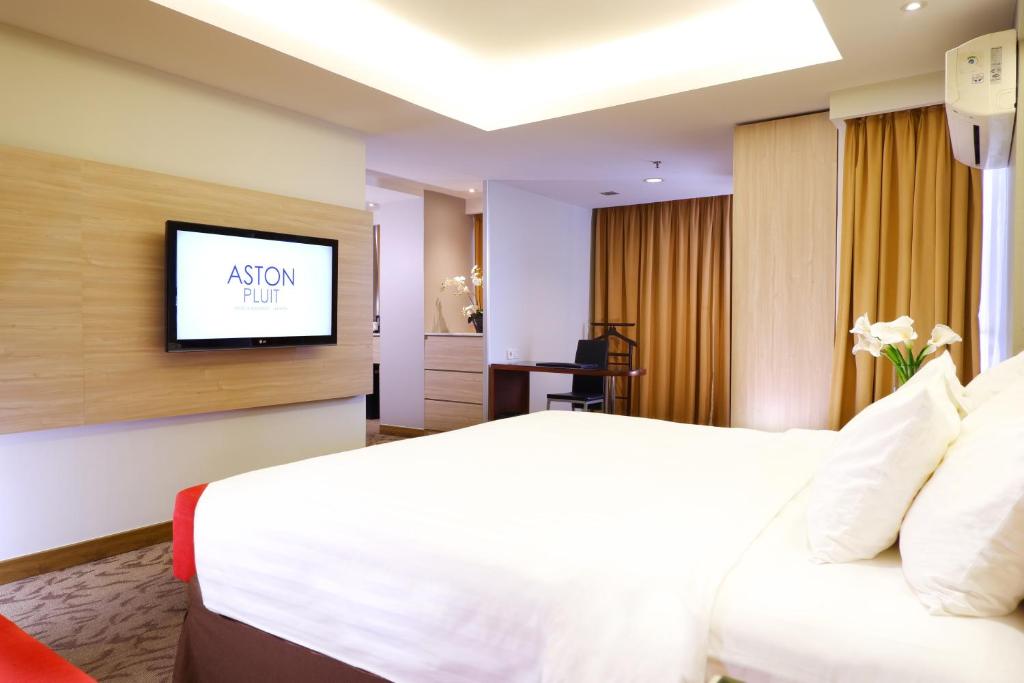 Postel nebo postele na pokoji v ubytování ASTON Pluit Hotel & Residence
