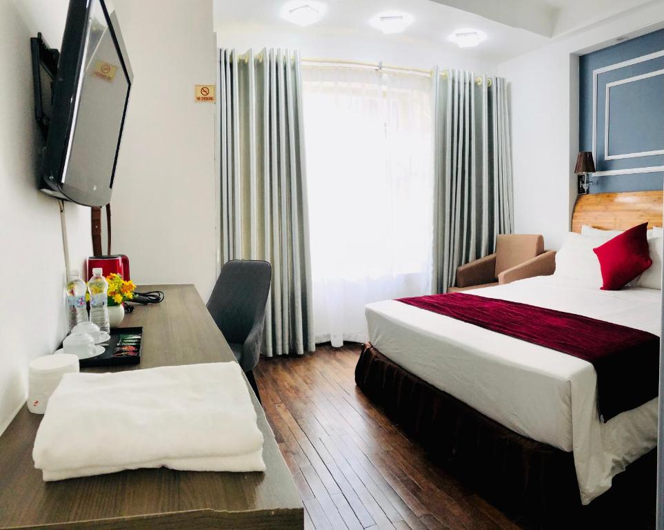 Postel nebo postele na pokoji v ubytování Hanoi Sisters Boutique Hotel & Spa & Travel