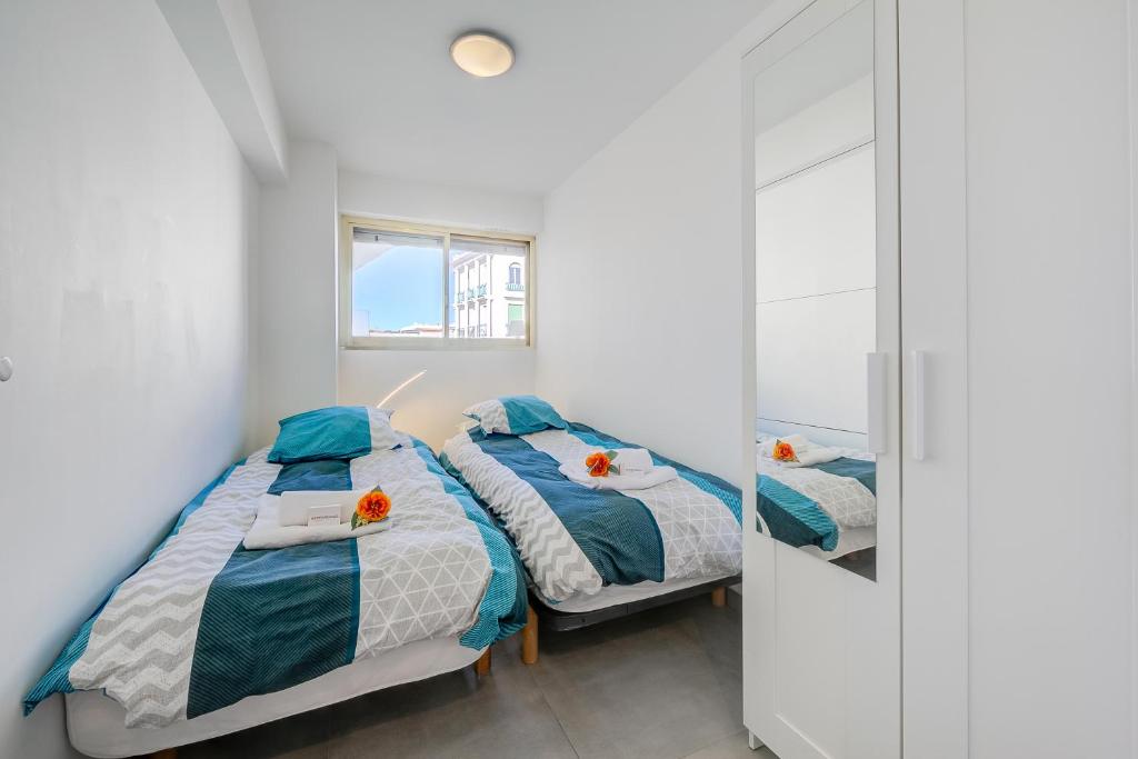 Postel nebo postele na pokoji v ubytování Le Bristol V - Happy Rentals