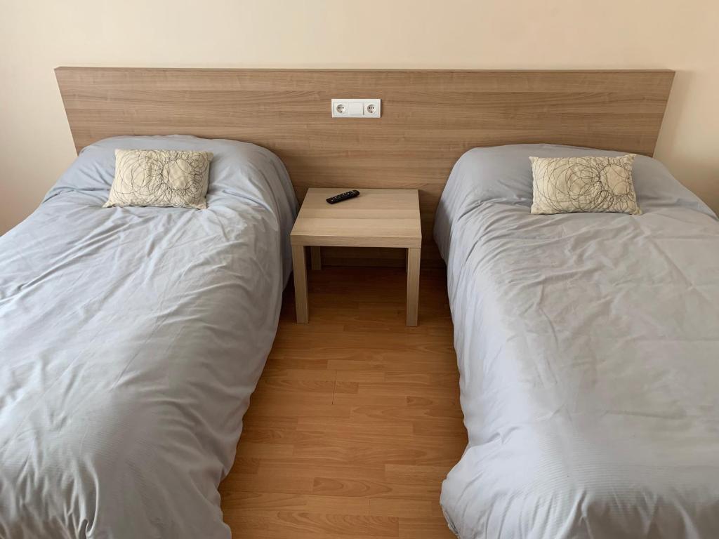 Postel nebo postele na pokoji v ubytování Pension Valcarce