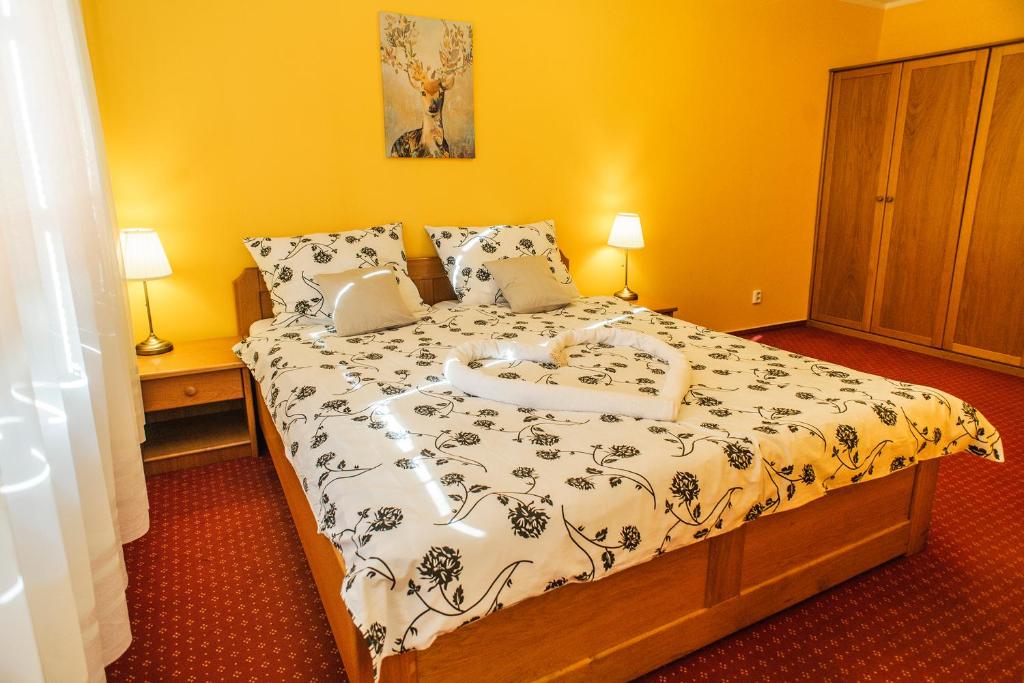 Postel nebo postele na pokoji v ubytování Penzion Lhotka