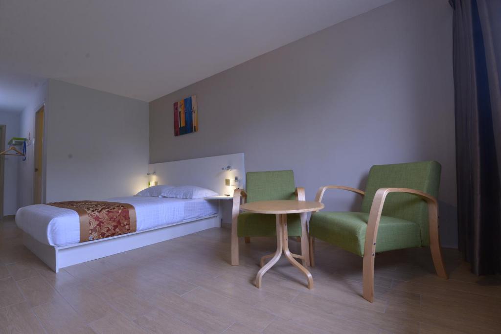 Postel nebo postele na pokoji v ubytování Hotel Pintar