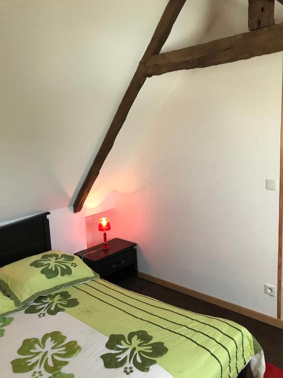 Postel nebo postele na pokoji v ubytování Manoir de Parc ar Brun