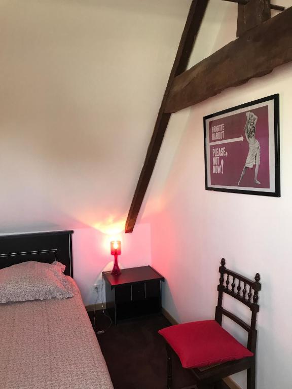 Postel nebo postele na pokoji v ubytování Manoir de Parc ar Brun