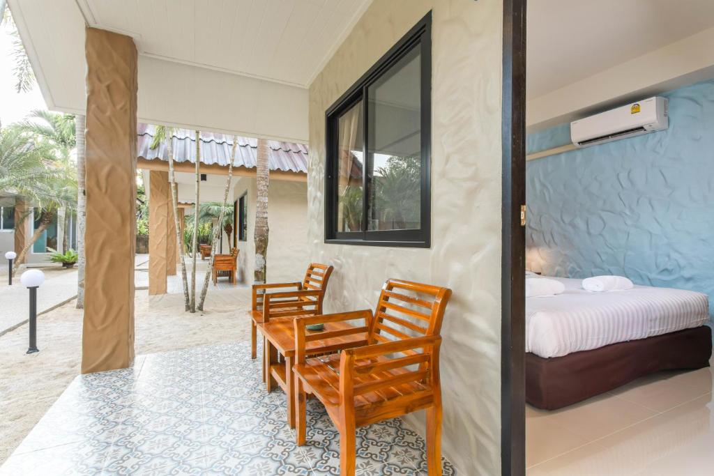 Postel nebo postele na pokoji v ubytování Lightplus Khao Lak