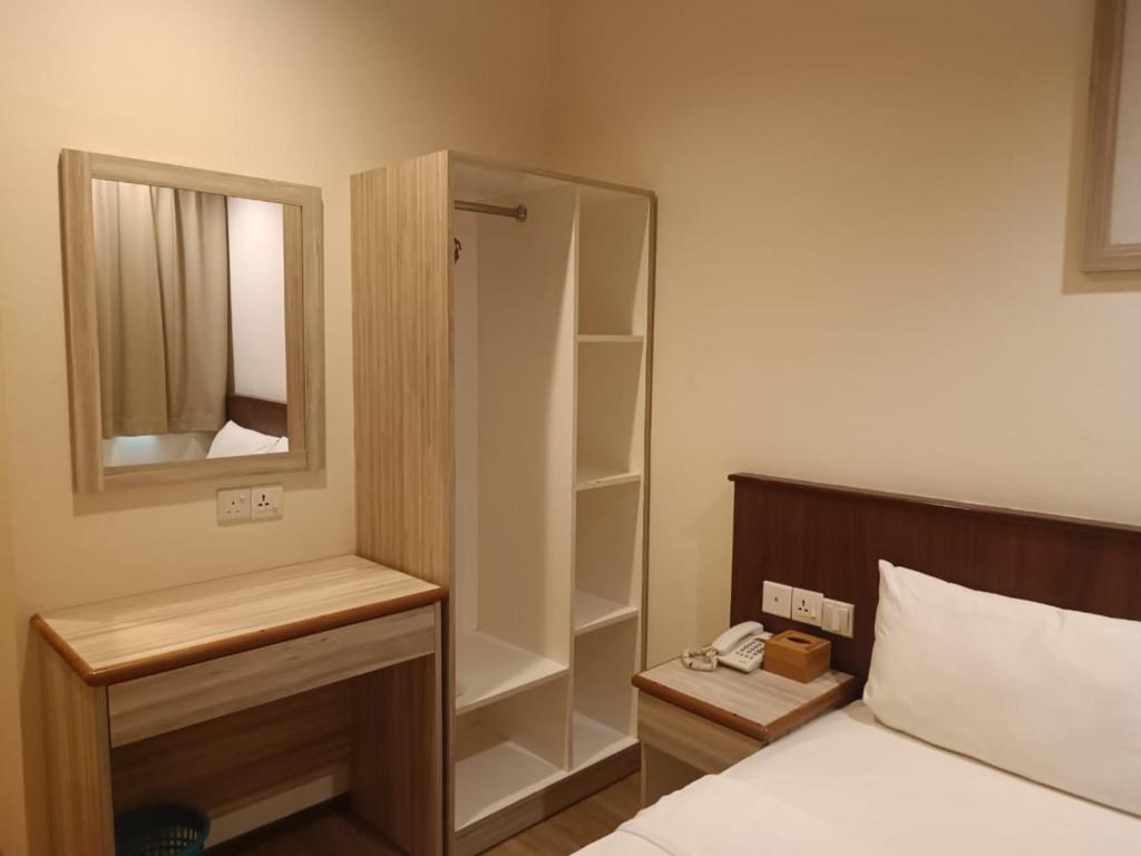 Postel nebo postele na pokoji v ubytování AMB LAI LAI HOTEL