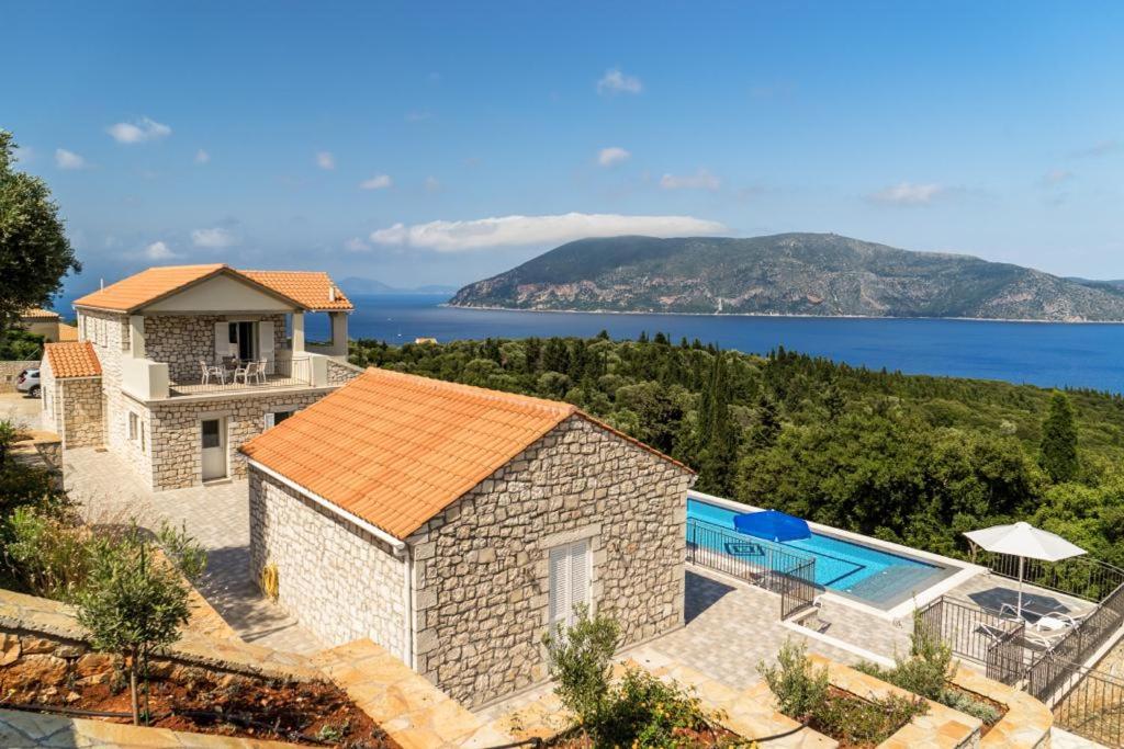 an aerial view of a house with a swimming pool at Villa Gionis in Fiskardho