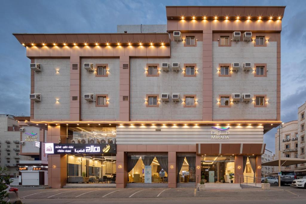 a large building with lights on top of it at Mirada Purple - Al Waha in Jeddah