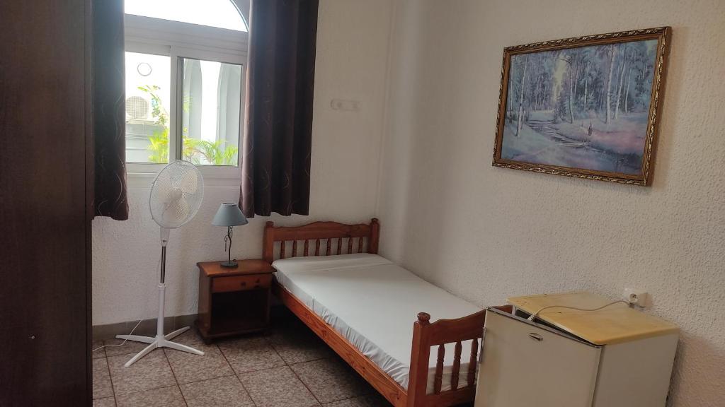 Postel nebo postele na pokoji v ubytování Hôtel Le Nathania