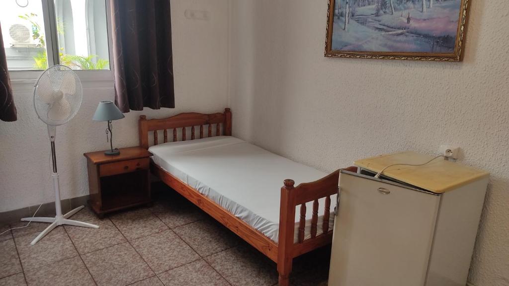Postel nebo postele na pokoji v ubytování Hôtel Le Nathania
